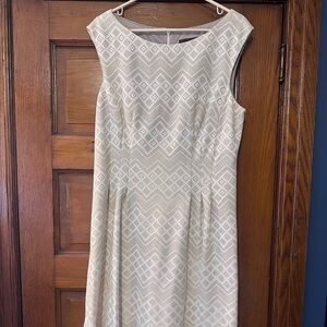 Knee length off white dress. Glitter throughout